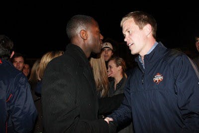 Turnage shakes hands with runner up Kel Jackson. Jackson received 2,184 votes, 32 percent. (Emily Adams / Photo Editor)