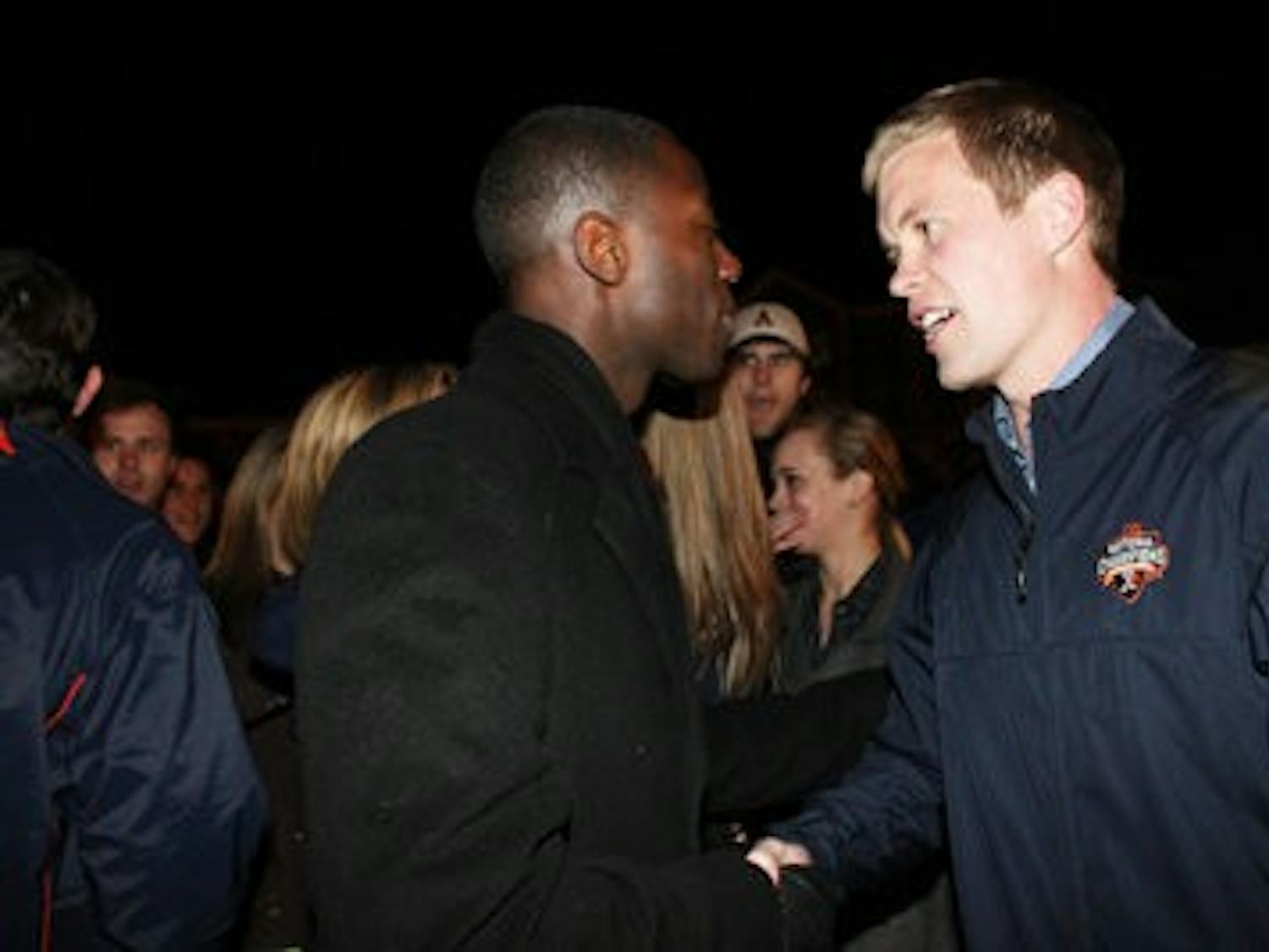 Turnage shakes hands with runner up Kel Jackson. Jackson received 2,184 votes, 32 percent. (Emily Adams / Photo Editor)