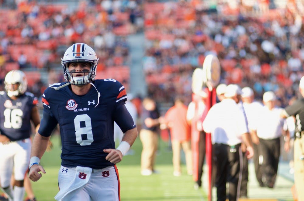 Jarrett Stidham (8) warms up before the Alabama State vs. Auburn football game on Saturday, Sept. 8, 2018, in Auburn, Ala.