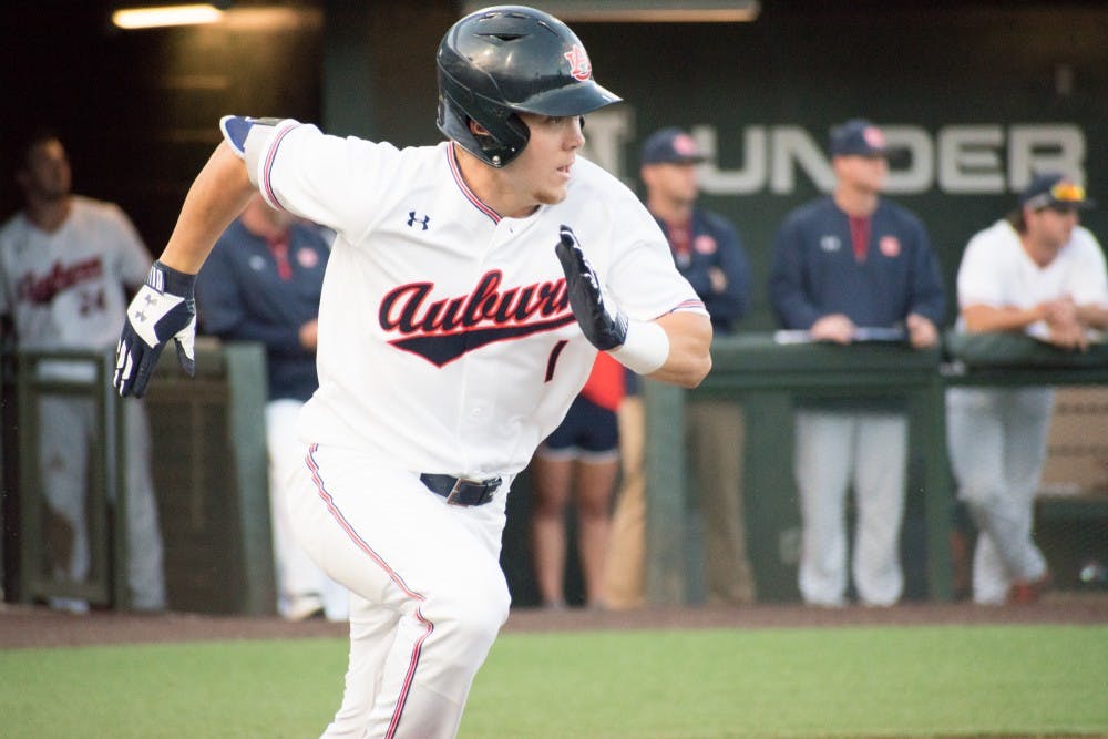 Judd Ward (1) runs toward first base at Auburn baseball vs. Samford on Tuesday, April 24, 2018, in Auburn, Ala.