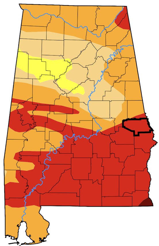 A Drought Monitor of Alabama showing varying shades of orange, yellow, and red.