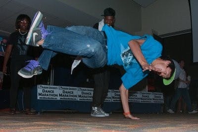 Vincent Tsai, sophomore industrial design, break dances at the AU Dance Marathon. Philip Smith / ASSISTANT PHOTO EDITOR