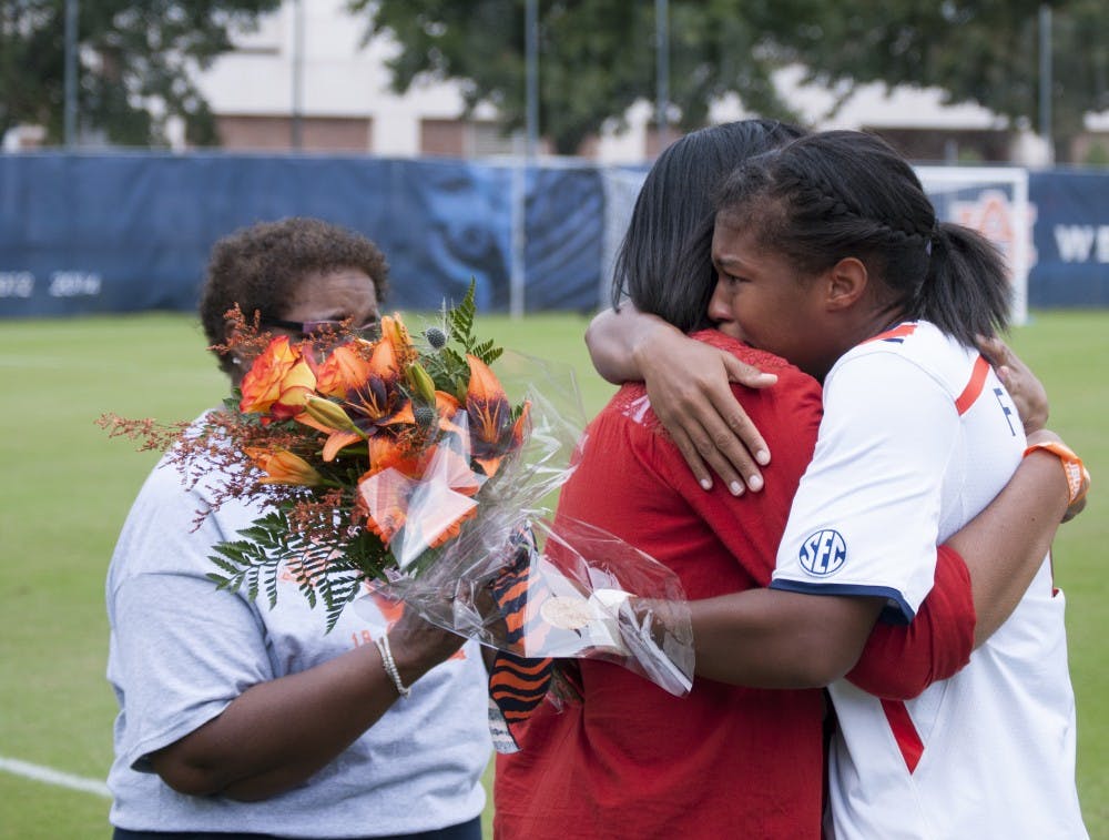 Kala Faulkner, senior defender, hugs her mother during Senior Day before the Auburn's match against the Georgia Bulldogs at the Auburn Soccer Complex on Sunday, Oct. 25.