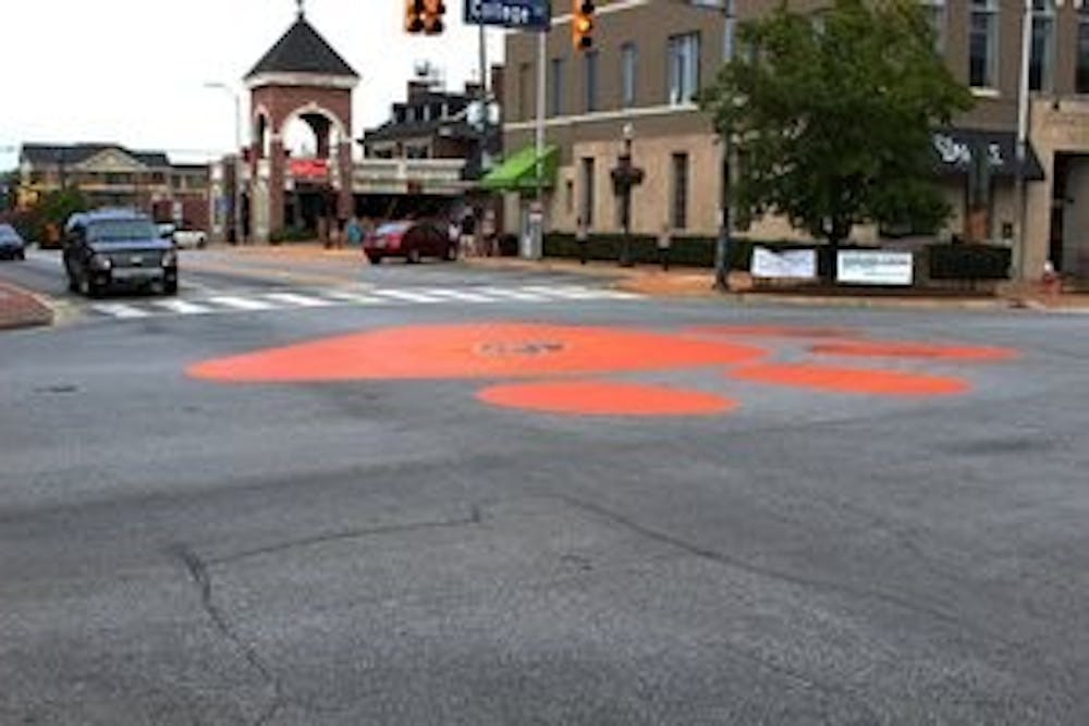 The famous orange tiger paw of Toomer's Corner had the addition of a blue "AU" emblem to its center this week.