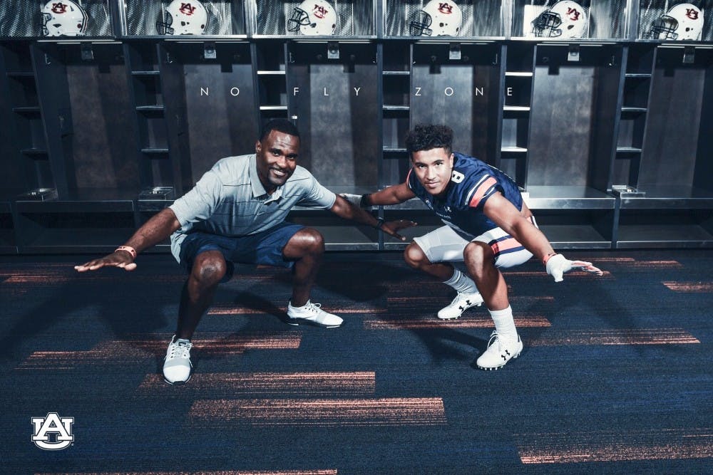 Kelly and Auburn assistant coach Marcus Woodson via Twitter photo.
