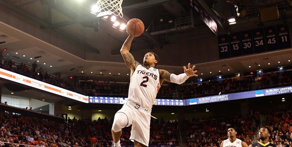 <p>Bryce Brown (2) dunks in transition during Auburn basketball vs. Murray State on Dec. 22, 2018, in Auburn, Ala.</p>