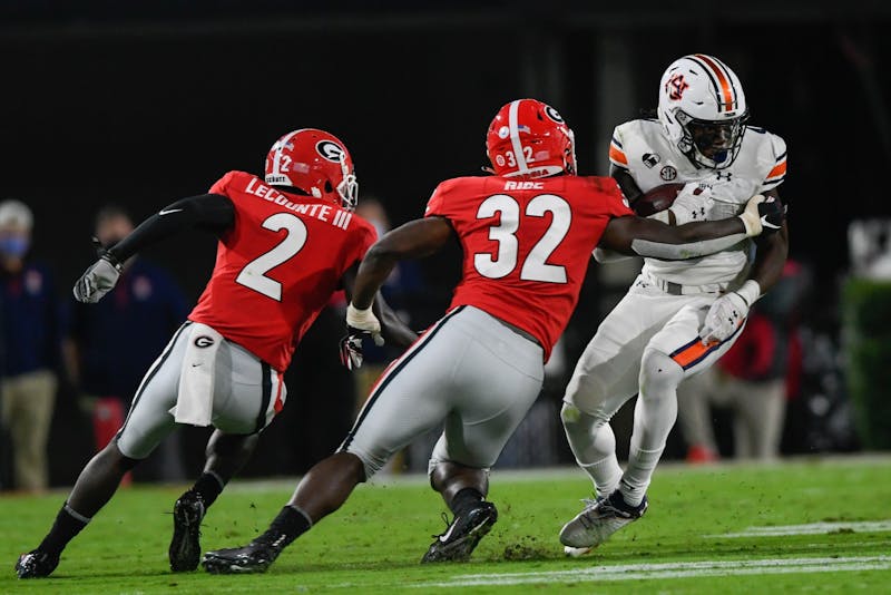 Oct 3, 2020; Athens, GA, USA; Tank Bigsby (4) rushes with the ball during the game between Auburn and Georgia at Samford Stadium. Mandatory Credit: Todd Van Emst/AU Athletics