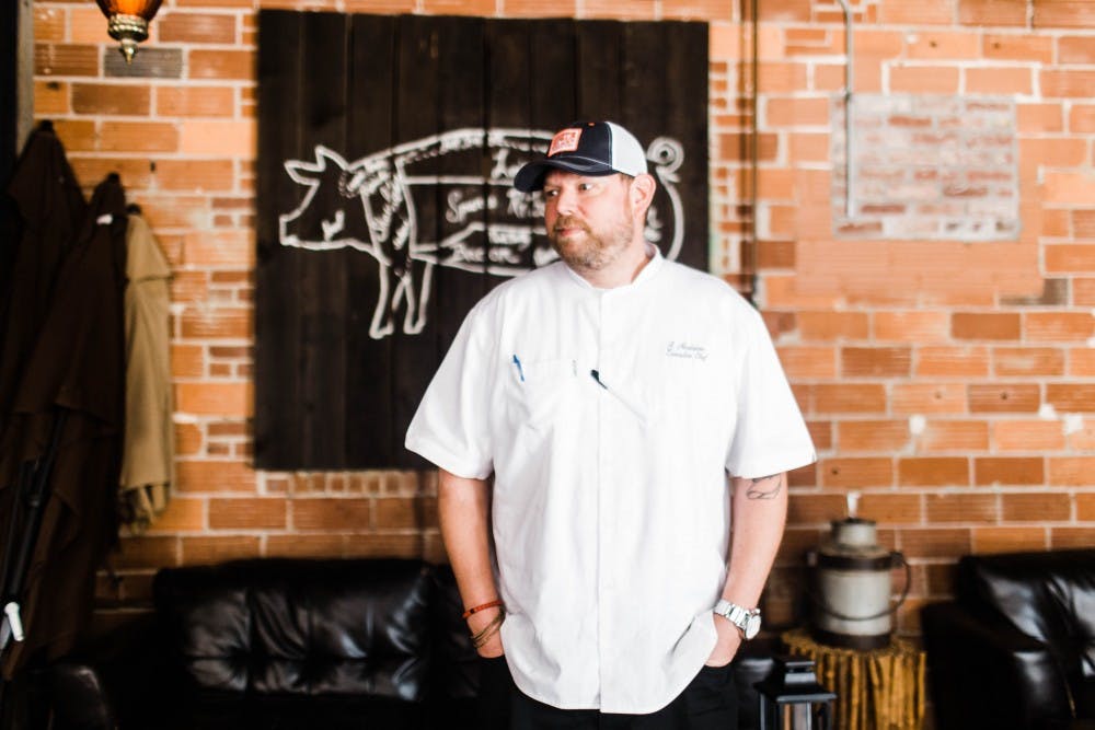 <p>Robbie Nicolaisen discusses his experience being the head chef at the Hound on July 6, 2017, in Auburn, Ala.&nbsp;</p>