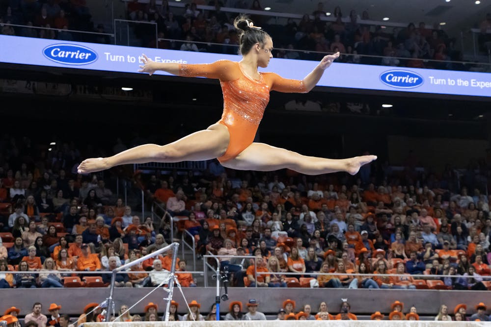 Cassie Stevens performs her beam routine in Neville Arena versus Alabama on February 9th, 2024. 