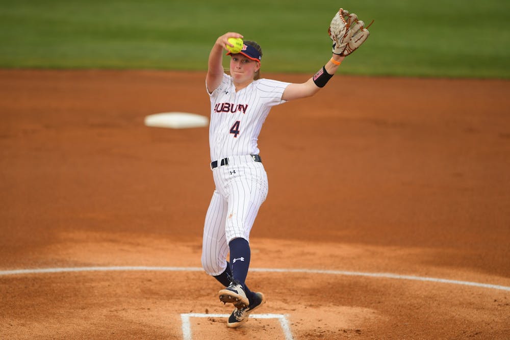 <p>Auburn Tigers Maddie Penta (4) delivers during the game between Auburn and IUPUI &nbsp;at Jane B. Moore Field on Feb 27, 2021; Auburn, AL, USA. Photo via: Shanna Lockwood/AU Athletics</p>