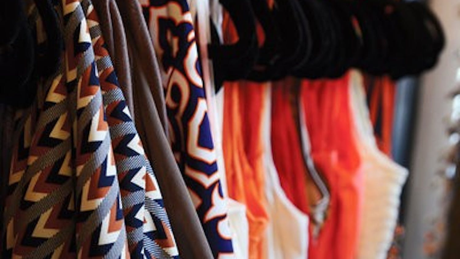 Gameday dresses hanging in Therapy Boutique.