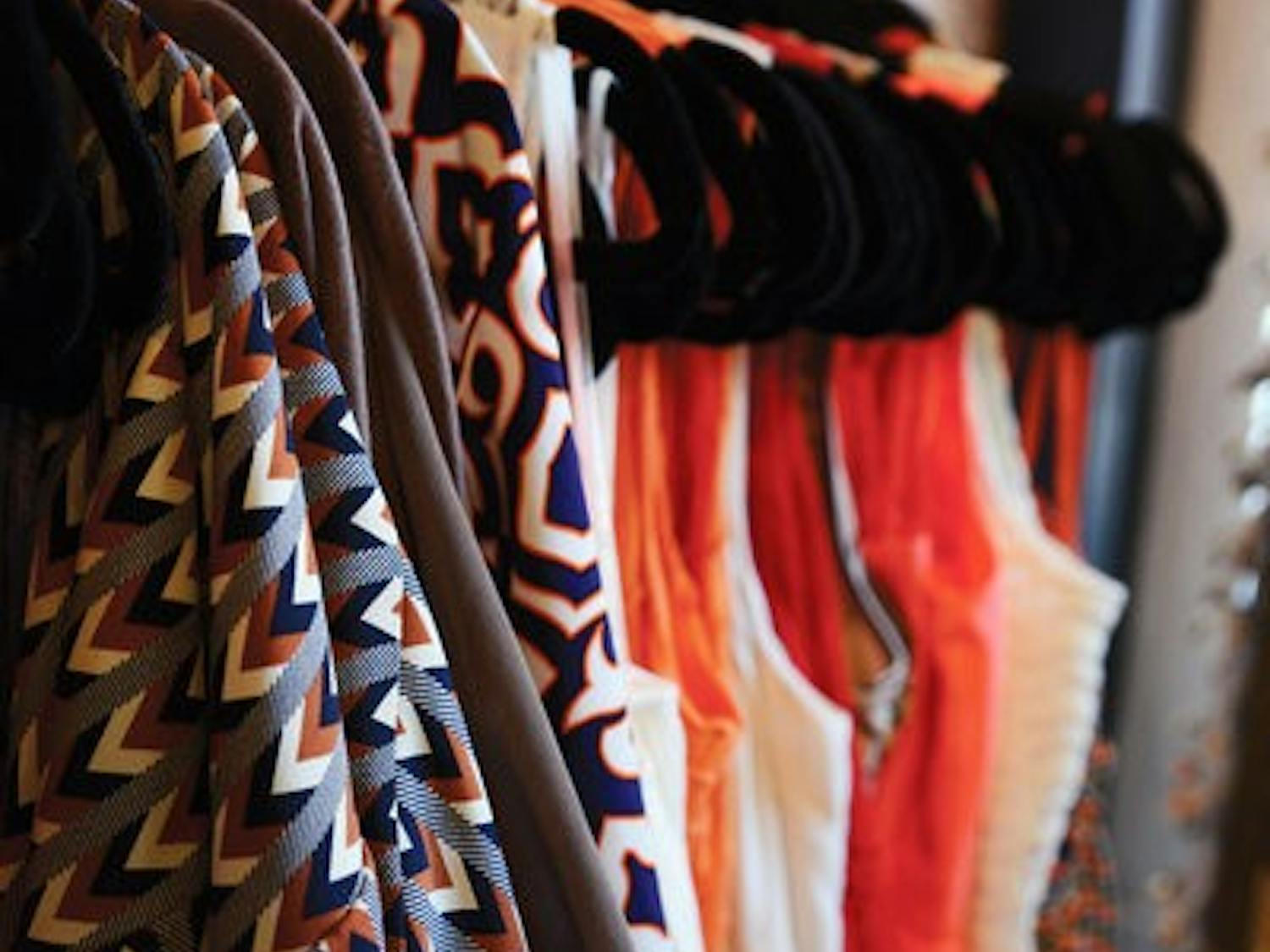 Gameday dresses hanging in Therapy Boutique.