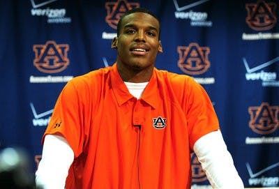 Cam Newton speaks at the football presser on Tuesday. (Todd Van Emst / Auburn Media Relations)