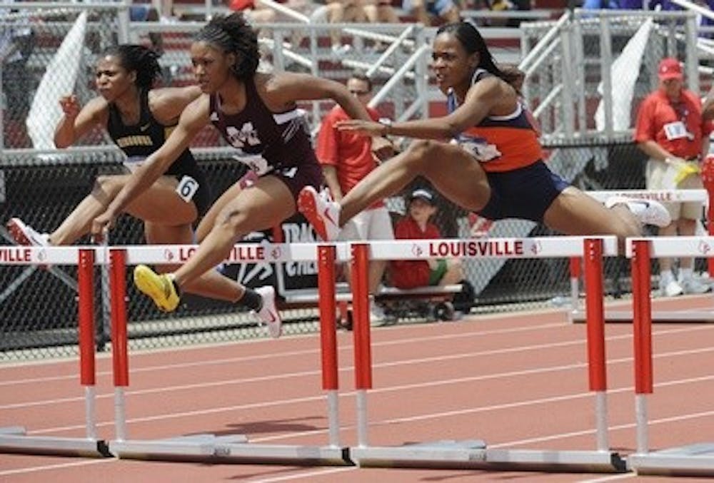 Auburn's Danielle Gilchrist, right, runs the prelims of the 100 meter hurdles Friday.Track NCAA East Regional on Friday, May 29, 2009 in Louisville, KY.Todd Van Emst