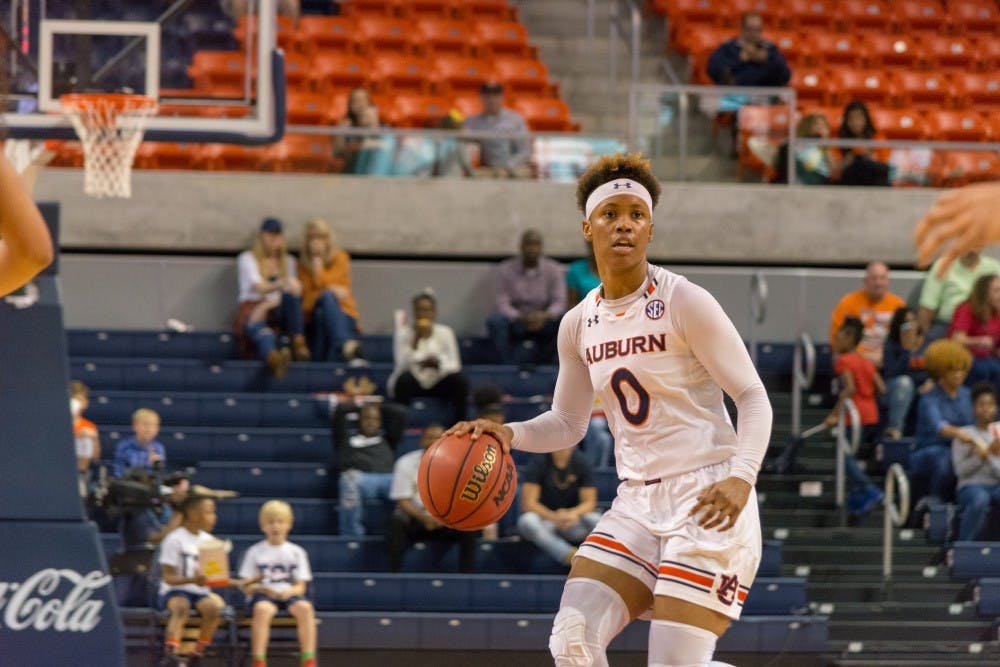 Daisa Alexander (0) looks for a teammate to pass to during Auburn Women's Basketball vs. Ole Miss on Sunday, Feb. 25, 2018, at Auburn Arena in Auburn, Ala.
