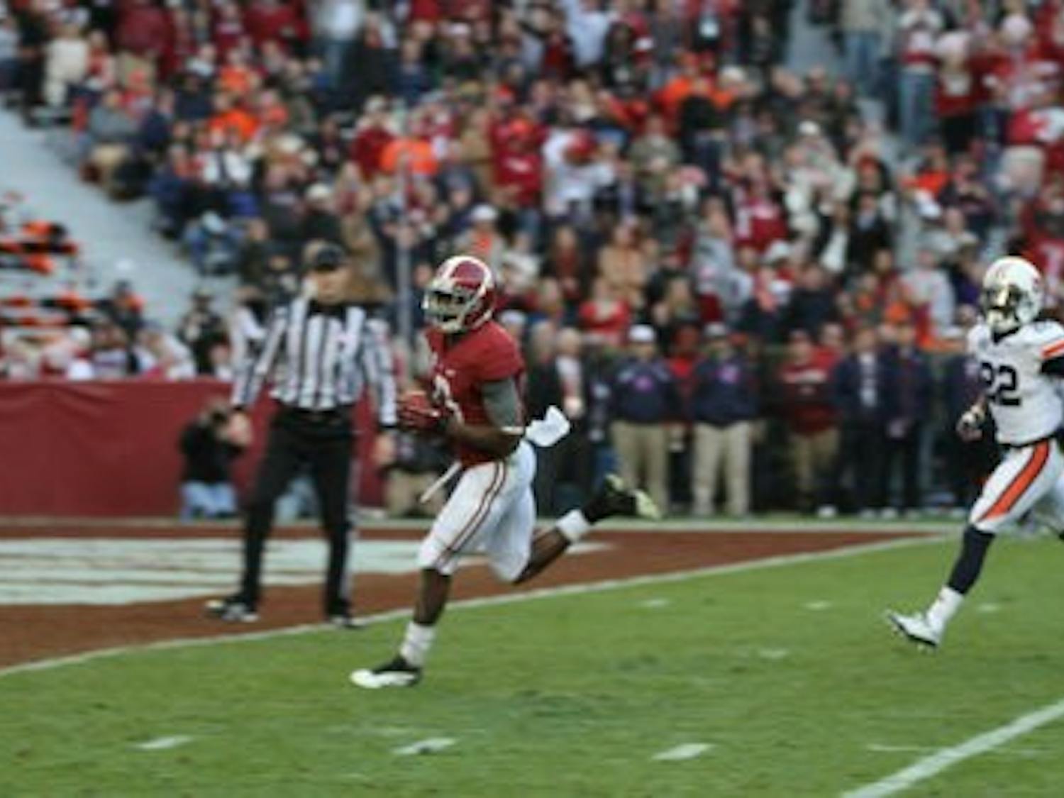 Alabama receiver Amari Cooper hauls in one of his two first half touchdown receptions in the Crimson Tide's 49-0 Iron Bowl rout of Auburn. (Danielle Lowe / ASSISTANT PHOTO EDITOR)