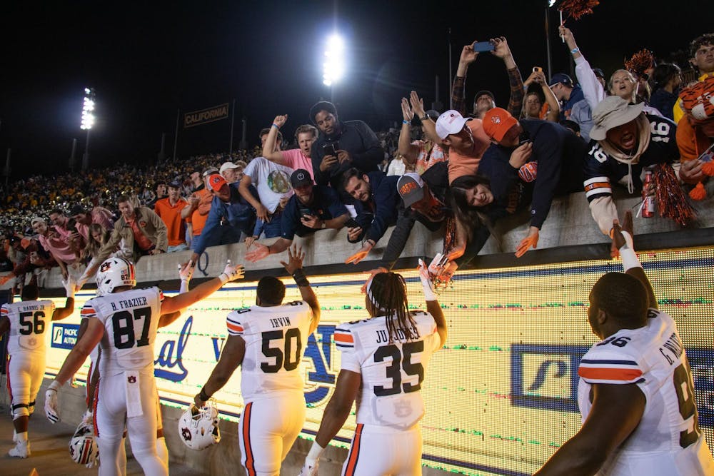 <p>Auburn players and fans celebrate at California Memorial Stadium after Auburn defeated UC Berkeley on Sept. 9, 2023.</p>