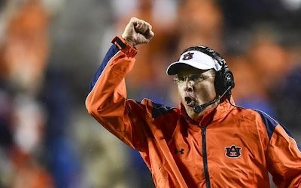 Auburn head coach Gus Malzahn celebrates during a 45-21 victory over Arkansas on August 31, 2014 (Zach Bland | Auburn Athletics)