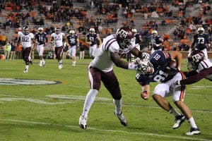 Wide receiver C.J. Uzomah is tackled by the Texas A&M defense. (Rebecca Croomes / PHOTO EDITOR)