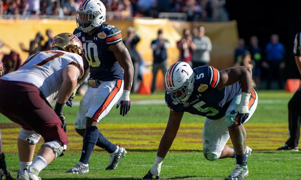 <p>Derrick Brown (5) and Owen Pappoe (10) wait for the snap during Auburn vs. Minnesota on Jan. 1, 2020, in Tampa, Fla.</p>