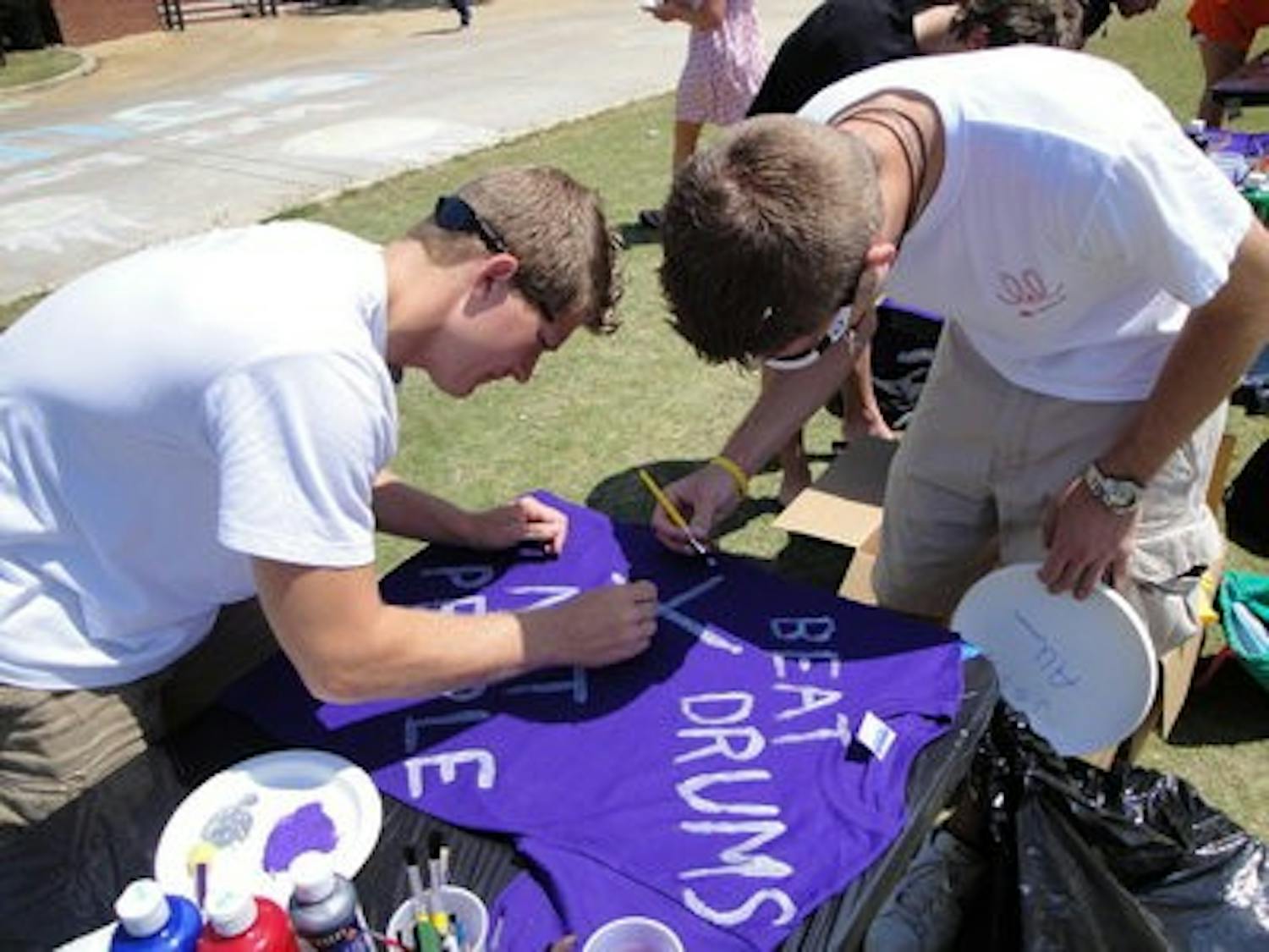 Participants of the 2009 Sexual Assault Awareness Month decorate a T-shirt for the month's "Clothesline" event. (Contributed by Women's Resource Center)