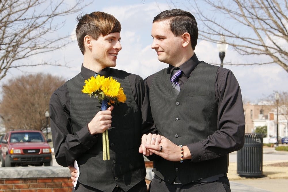 Justin and Shawn Williams pose after their marriage ceremony. Feb 9, 2015 in Opelika, AL. Ellen Jackson | Photographer)
