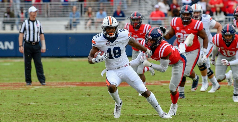 <p>Seth Williams (18) runs after a catch during Auburn football vs. Ole Miss on Oct. 20, 2018, in Oxford, Miss.</p>
