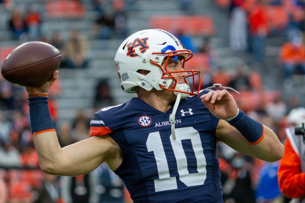 <p>Bo Nix (10) warms up before a football game between Ole Miss and Auburn on Oct. 30, 2021, from Jordan-Hare Stadium in Auburn, AL, USA.</p>