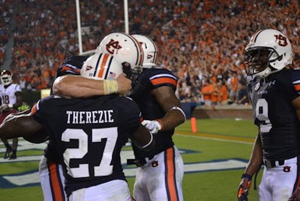 Robenson Therezie celebrating with his teammates after his second interception.