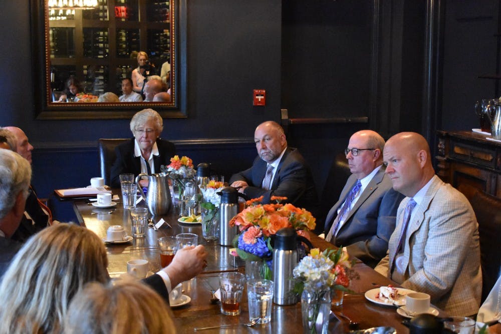 Gov. Kay Ivey sits at a community roundtable discussion on July 25, 2017 in Auburn, Ala.