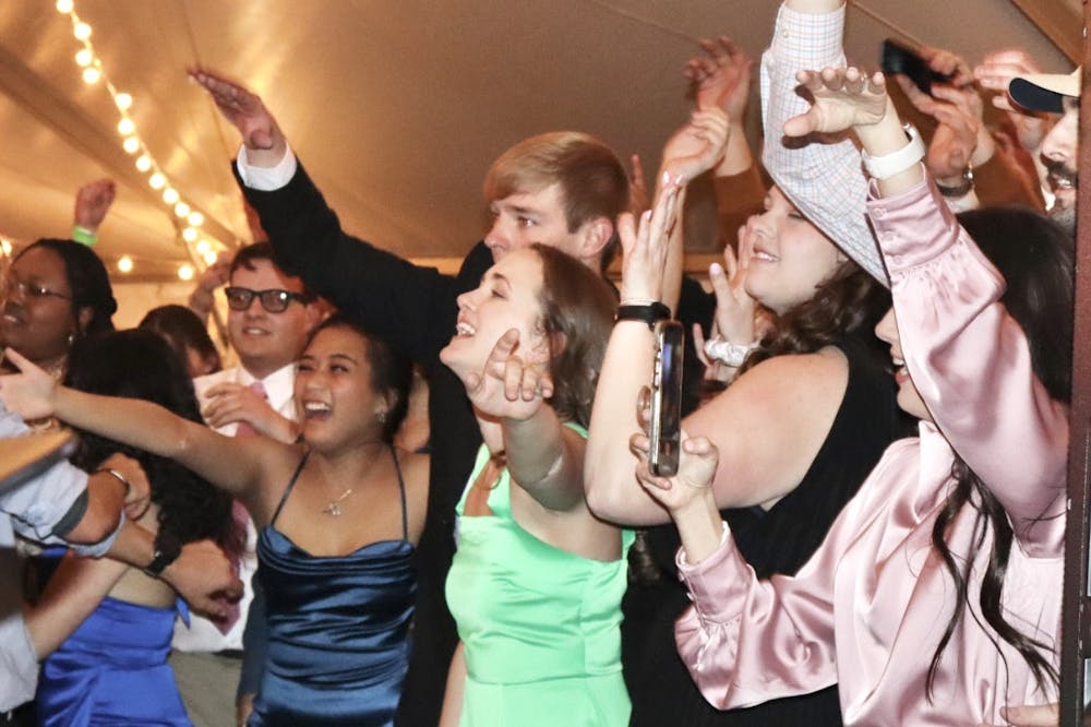 Auburn students sing along to a live band at the 2nd annual Magnolia Ball held on Samford Lawn on Mar. 18, 2023.
