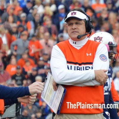 Gus Malzahn with watermark in a sweater