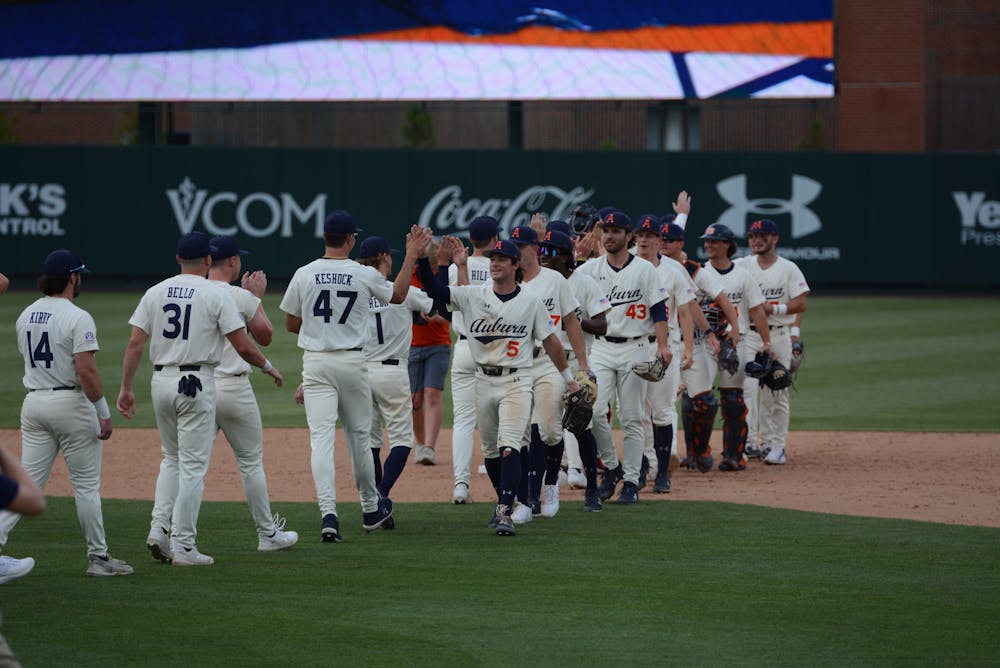 <p>Auburn players congratulate each other following the team's third win over Missouri, giving the team a sweep of the series and an eight-game winning streak to conclude the season.</p>