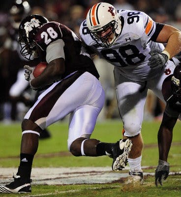 Senior defensive lineman Zach Clayton tackles Mississippi State running back Vick Ballard in Auburn's 17-14 win. (Todd Van Emst / Auburn Media Relations)