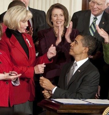 President Obama congratulates Lilly Ledbetter after signing the Lilly Ledbetter Fair Pay Act, his first bill as president. (Contributed)