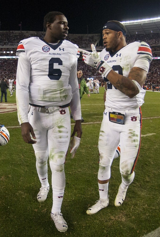 Jeremy Johnson (6) and Tray Matthews (28) have a chat following Auburn's loss to Alabama. Auburn vs Alabama on Saturday, Nov. 26 in Tuscaloosa, AL.