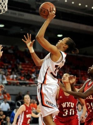 Auburn's Tyrese Tanner (32) gets around Western Kentucky's Chastity Gooch (30) and Alexis Govan (21) in the second half during Auburn's Women's National Invitation Tournament second-round basketball game vs Western Kentucky. (Courtesy of Auburn Athletics)