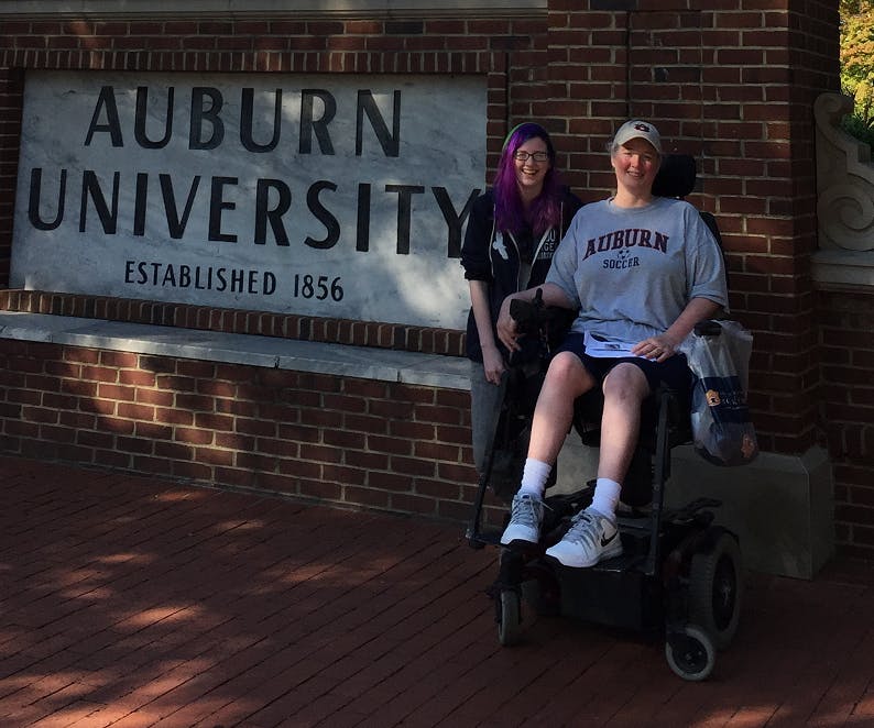 Mom and I infront of Auburn sign.png