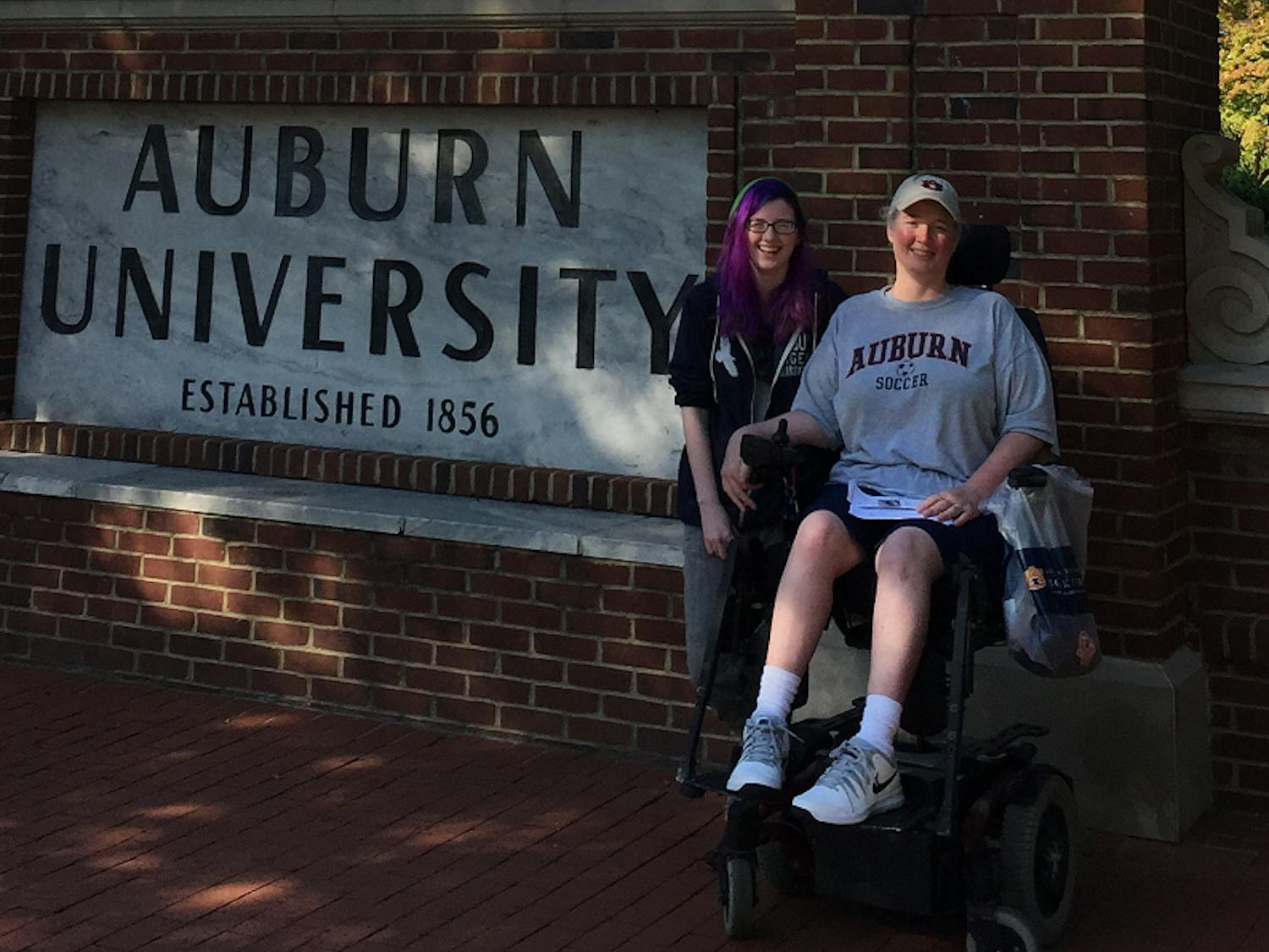 Mom and I infront of Auburn sign.png