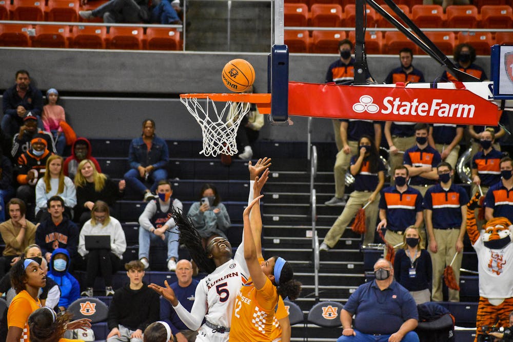 January 27, 2022; Auburn, Alabama; Aicha Coulibaly (5) lays the ball up into the basket in a match between Auburn and Tennessee in the Auburn Arena.