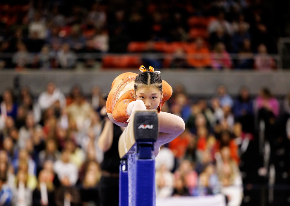 Katelyn Jong lies on the beam at the beginning of her routine against Oregon State on Jan. 25, 2025 at Neville Arena.