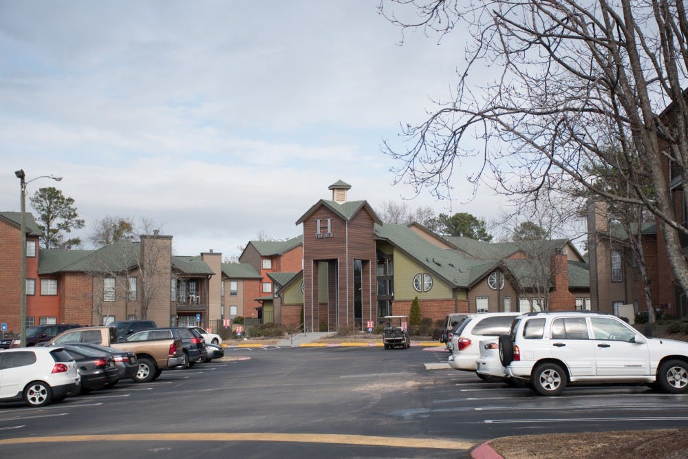 <p>Cars are parked outside of The Hub Apartment Homes complex in Auburn, Ala. on Friday, Feb. 9, 2018.</p>