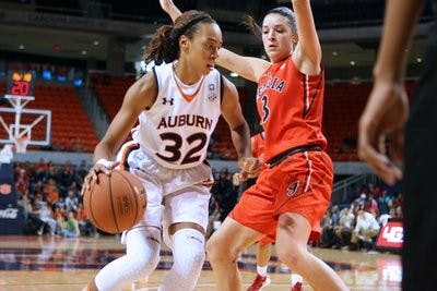 Sophomore forward Tyrese Tanner drives to the hoop against a Georgia defenderJan. 8. The Tigers lost the game 70-45. (Rebecca Croomes / PHOTO EDITOR)