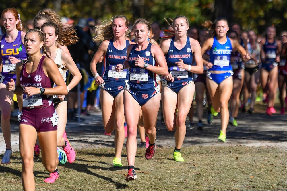 WEST COLUMBIA, SC - OCTOBER 27 - Mary Mac Collins, Hannah Tarwater, and Hallie Porterfield during the SEC Cross Country Championship at Charwood Golf Club in West Columbia, SC on Friday, Oct. 27, 2023.

Photo by Abby Grace Stevens/Auburn Tigers