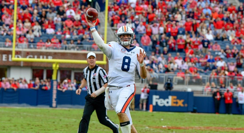 <p>Jarrett Stidham (8) throws a pass during Auburn football vs. Ole Miss on Oct. 20, 2018, in Oxford, Miss.</p>