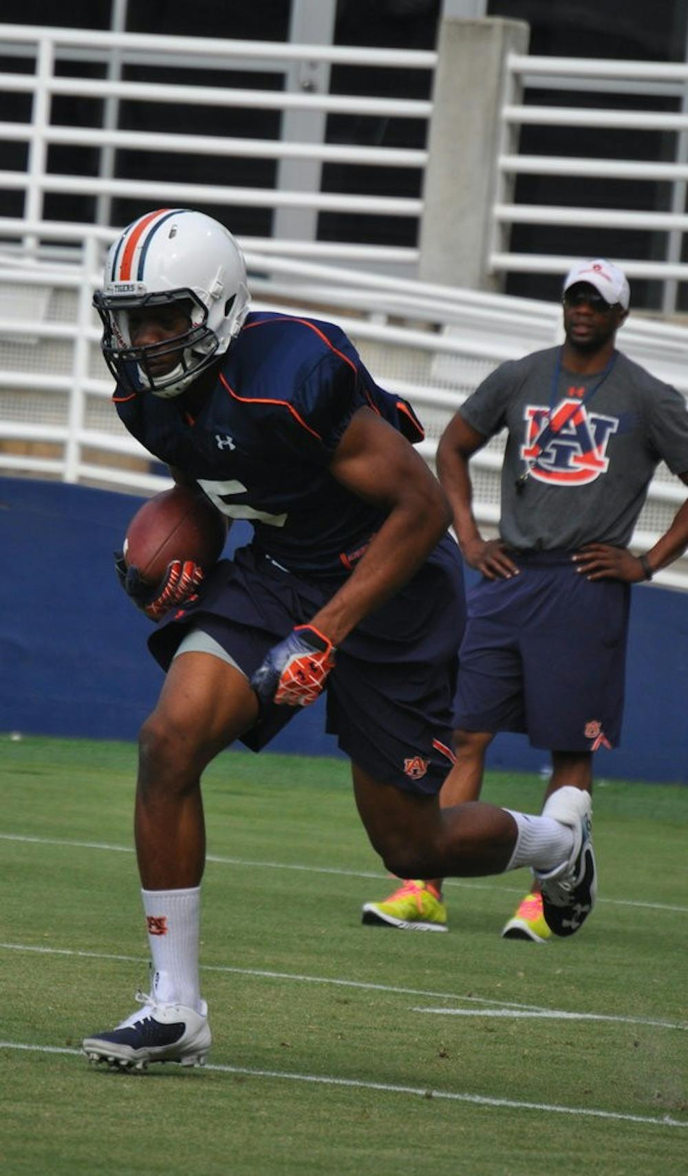 Assistant coach Dameyune Craig watches wide receiver Ricardo Louis return a punt during a drill on Monday.
Anna Grafton / ASSOCIATE PHOTO EDITOR