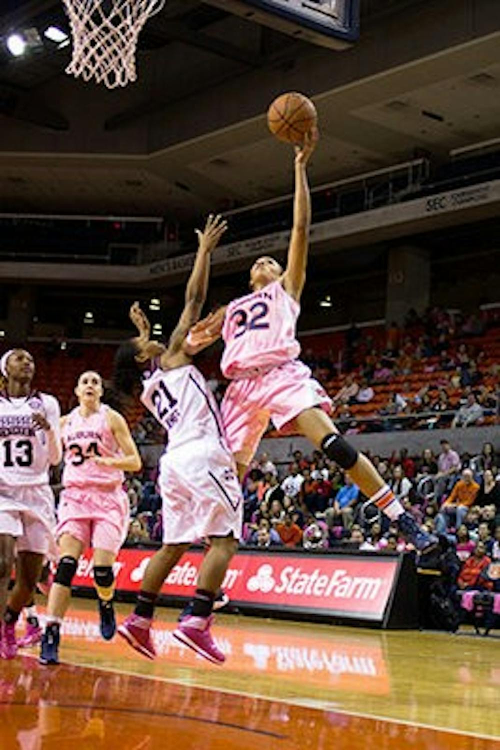 Tyrese Tanner goes for a layup over a Mississippi State player in a game earlier this month (Jenna Burgess / PHOTOGRAPHER)
