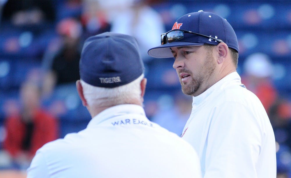 <p>Assistant coach Corey Myers talks with head coach Clint Myers during a timeout. Auburn vs Georgia State on Sunday, March 6 in Auburn, AL.</p>