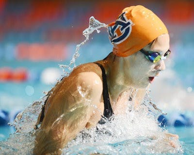 Chandler Gerlatch swims the breaststroke against the Florida Gators in the last home meet of the season. (Courtesy of Todd Van Emst)