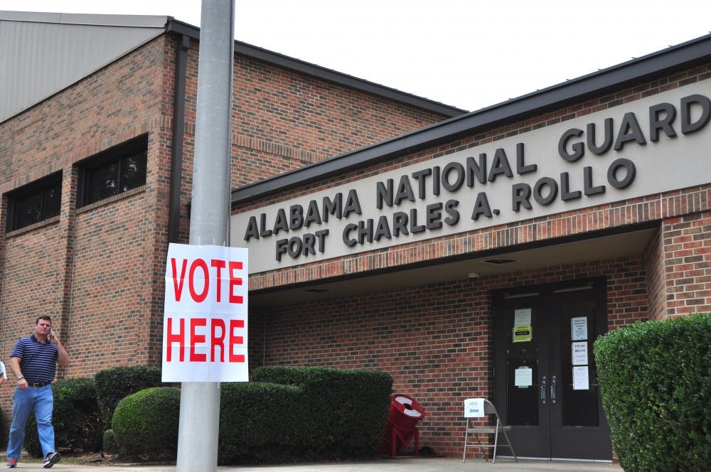 Voters walk out of a voting location in Auburn, Ala., on Tuesday, Nov. 8, 2016.